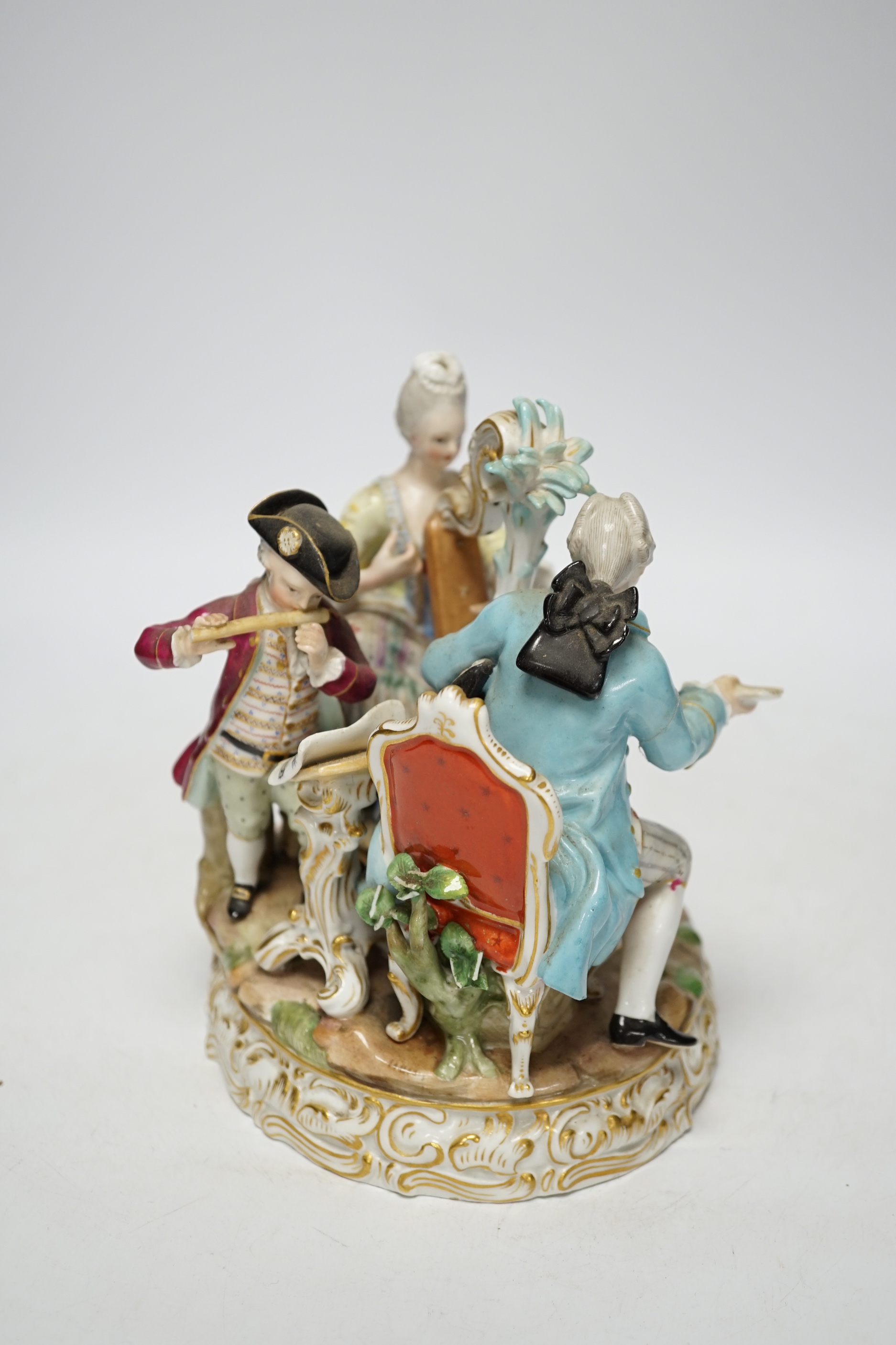 An early 20th century Meissen figure group of musicians, stamped D48, 18cm